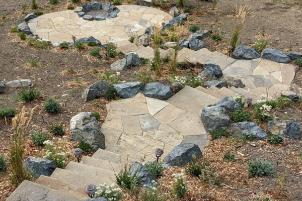Bozeman hardscaping -flagstone patio outdoor living space with montana boulders and stone steps