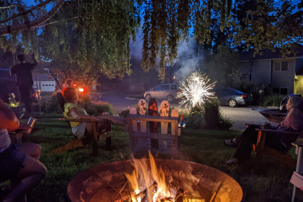 Bozeman outdoor living gathering around steel fire vase
