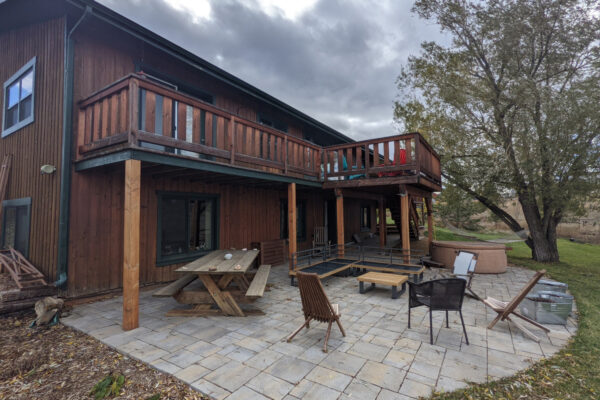 Concrete pavers patio Bozeman with Hot Tub and outdoor dining space