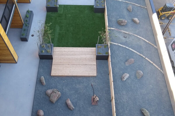 Downtown Commercial Landscaping on Rooftop with boulders, sandstone and raised planters