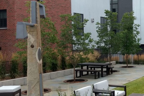 Downtown commercial landscaping with Bluestone Patio and sculpture