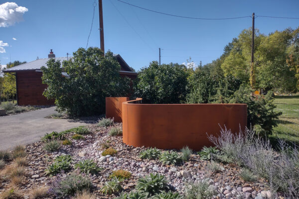 Dry Creek Bed and Custom Steel Landscaping Sculpture with Drought Tolerant Gardens