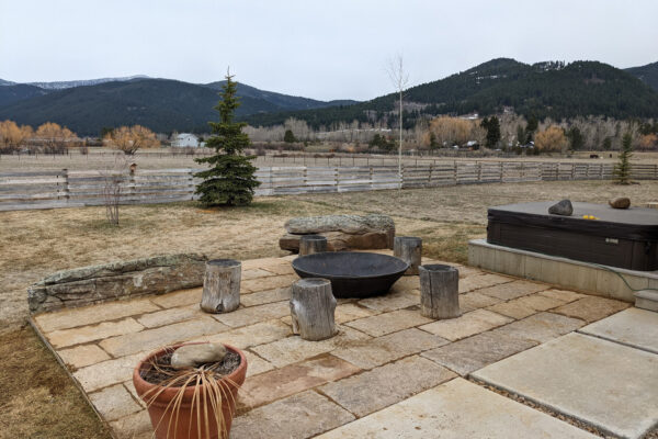 Massive flagstone pavers around firepit and hot tub in south Bozeman