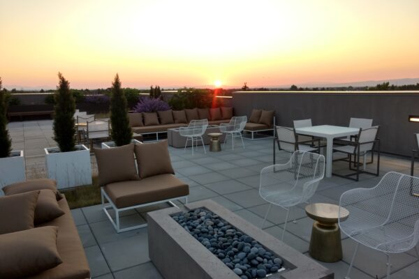 Modern Rooftop Landscaping with Gas Fire Pit and Concrete Paver Patio on rooftop in Bozeman Montana