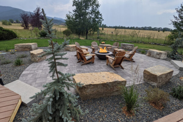 South Bozeman Concrete Paver Patio with Boulders and gas fire pit gathering area