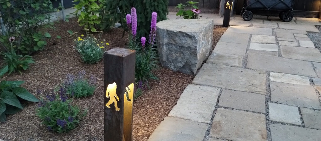 Landscape Lights and Hardscaping and Boulders and Drought Tolerant Perennials In High End Custom Landscaping Project In South Bozeman Montana