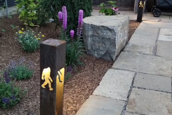 Landscape Lights and Hardscaping and Boulders and Drought Tolerant Perennials In High End Custom Landscaping Project In South Bozeman Montana