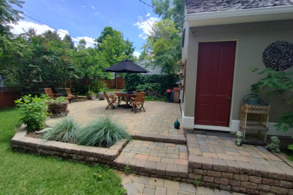 Bozeman Montana Landscapers use Concrete Pavers To Create A Dual Purpose Paver Driveway and Patio